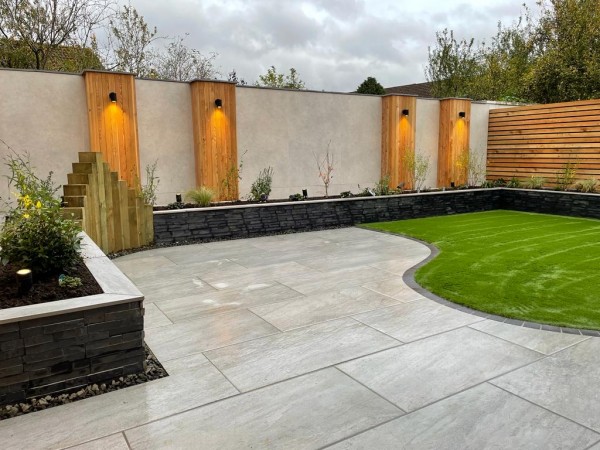 landscaped garden with attractive wall decorated using grey sand porcelain cladding