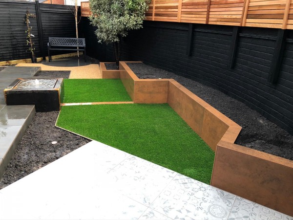 low raised bed with porcelain cladding decoration