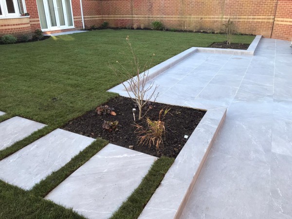 rectangular porcelain paving stepping stones set into a lawn