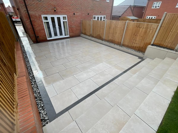 pale coloured patio bordered with Duomo Anthracite slim porcelain tiles