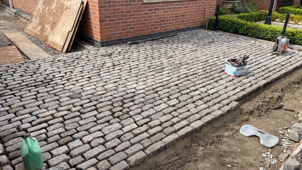 Reclaimed setts being used to build driveway 