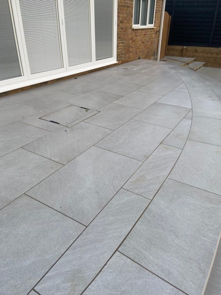 light grey patio in front of french doors