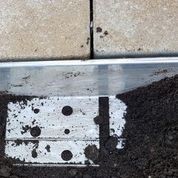 aluminium flexible edging applied between patio and soil border