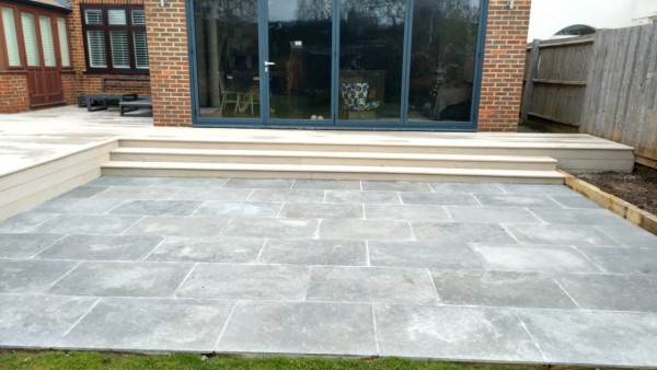 large sunken patio of sinai pearl grey honed/tumbled limestone paving