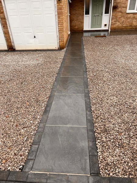Duomo anthracite porcelain paving path edged with border tiles