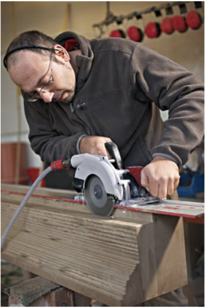 Wet saw being used with guide rails 