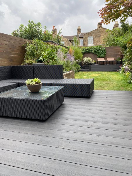 grey composite decking with modern patio furniture