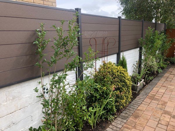Composite Fencing atop a garden wall 