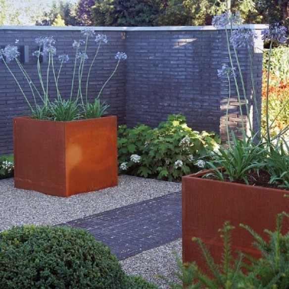 Selection of corten square planters populated with ornamental grasses