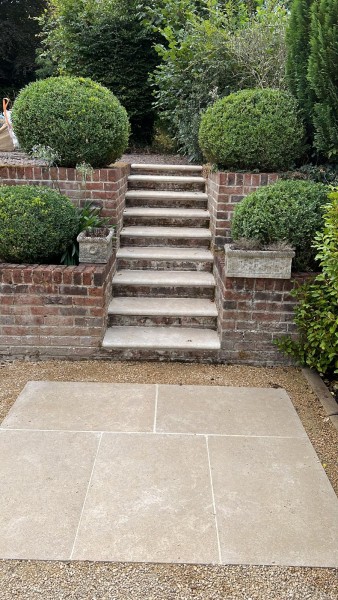 Limestone Paving in a small patio and stepping stone path