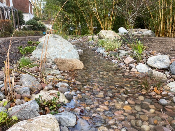 Glacial boulders used in landscaped stream 