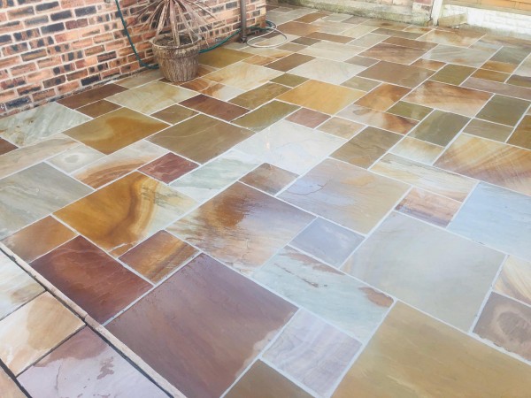 spotlessly clean sandstone patio after treating with masonry cleaner