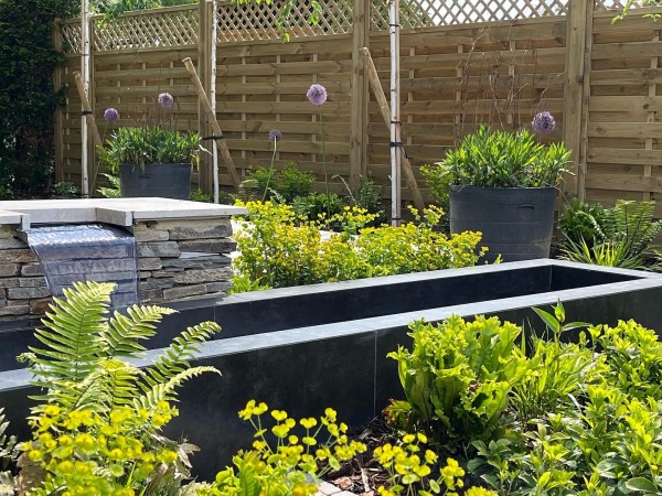 raised water feature clad with cool steel coloured porcelain