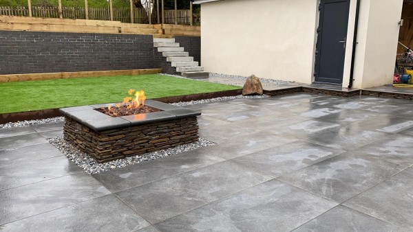Garden with fire pit and patio of fusion graphite porcelain paving 