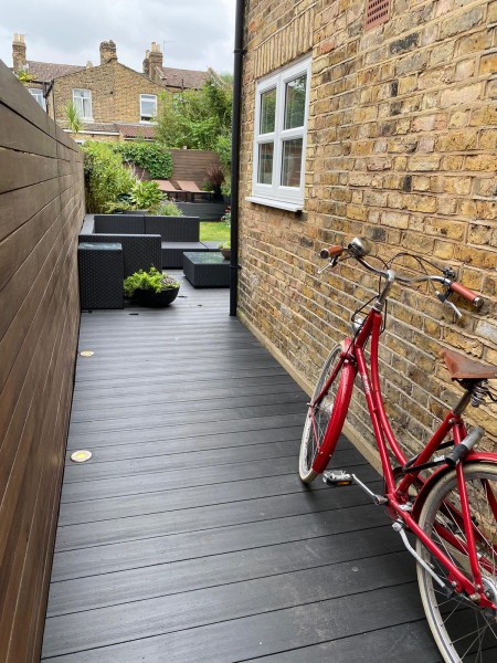 Side return for modern home with composite decking walkway