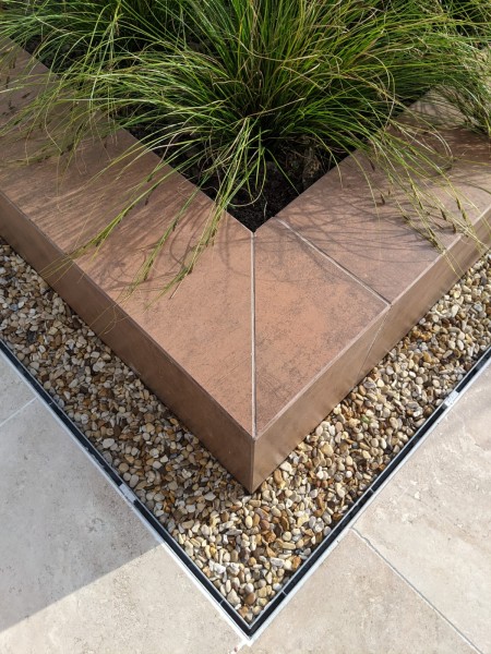 porcelain cladding used as coping stones for raised planters