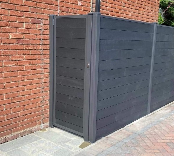 Composite Gate with composite fencing in garden 