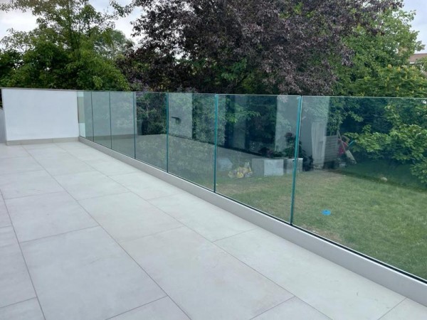 Tiled patio surrounded by Glass Balustrades