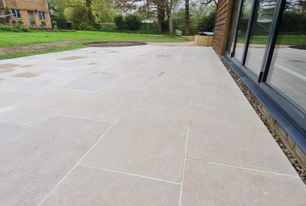 Sinai Pearl Beige Honed/Tumbled Pre-Sealed Limestone Paving in a garden setting