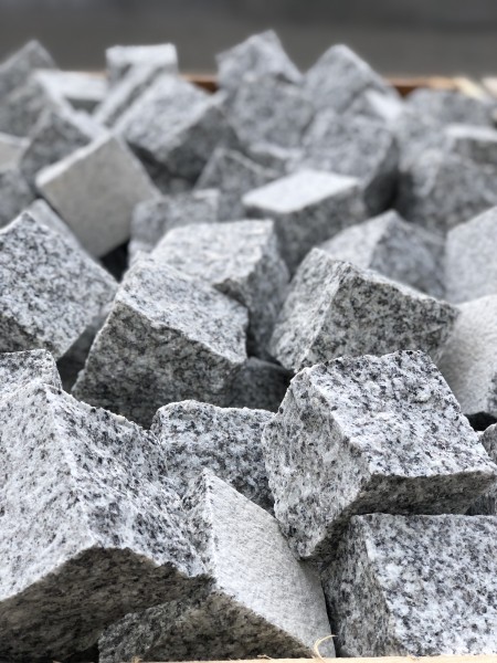 large pile of cubic granite setts