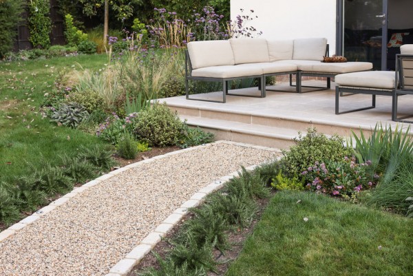 Sinai Pearl Beige Honed/Tumbled Pre-Sealed Limestone Bullnose Steps in a garden setting