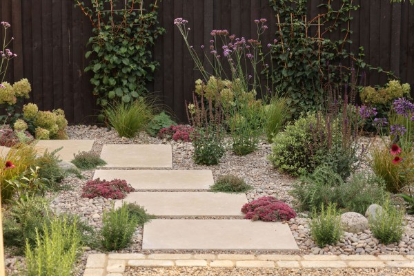 Sinai Pearl Beige Honed/Tumbled Pre-Sealed Limestone Paving in a garden setting