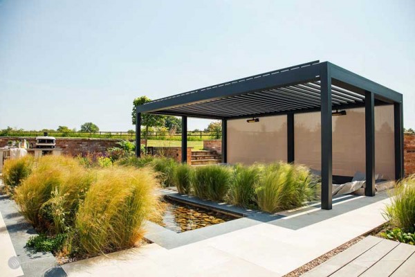 modern pergola in garden with pool