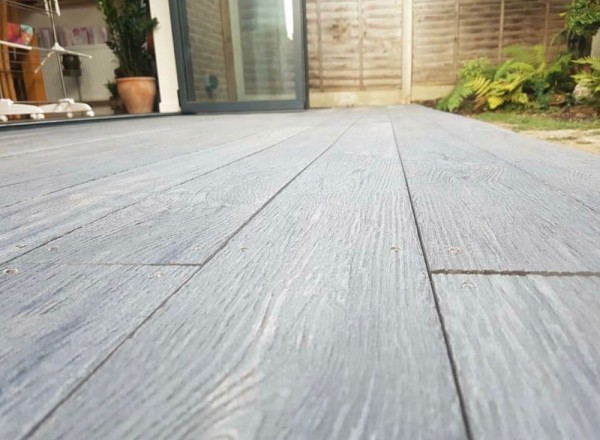 rustic dark grey composite decking supplied by Arbour Landscape Solutions