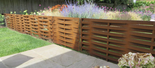 Corten Steel Woven Fence around garden boundary