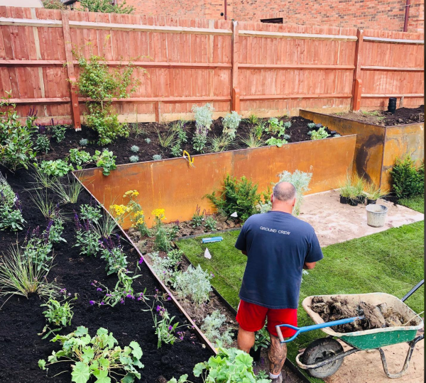 attractive garden with raised beds faced with corten steel