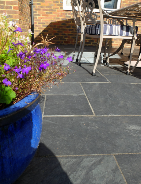 practical family patio using black paving slabs