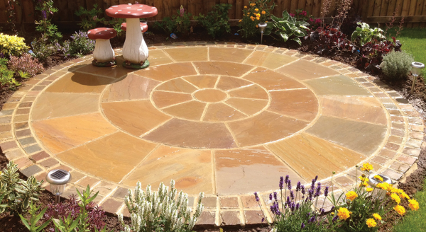 Buff sandstone circle in garden 