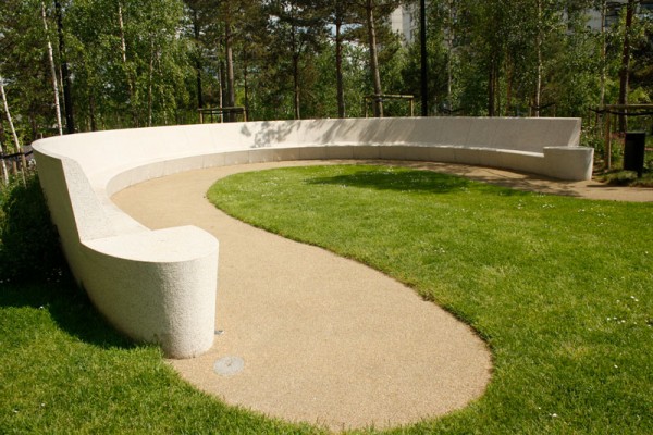Seating area in garden with species rich lawn turf 