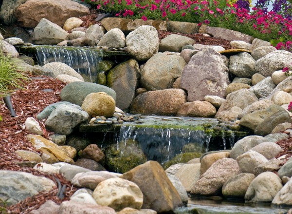 Glacial boulders used in landscaped stream 