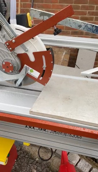 paver being cut with Raimond table saw