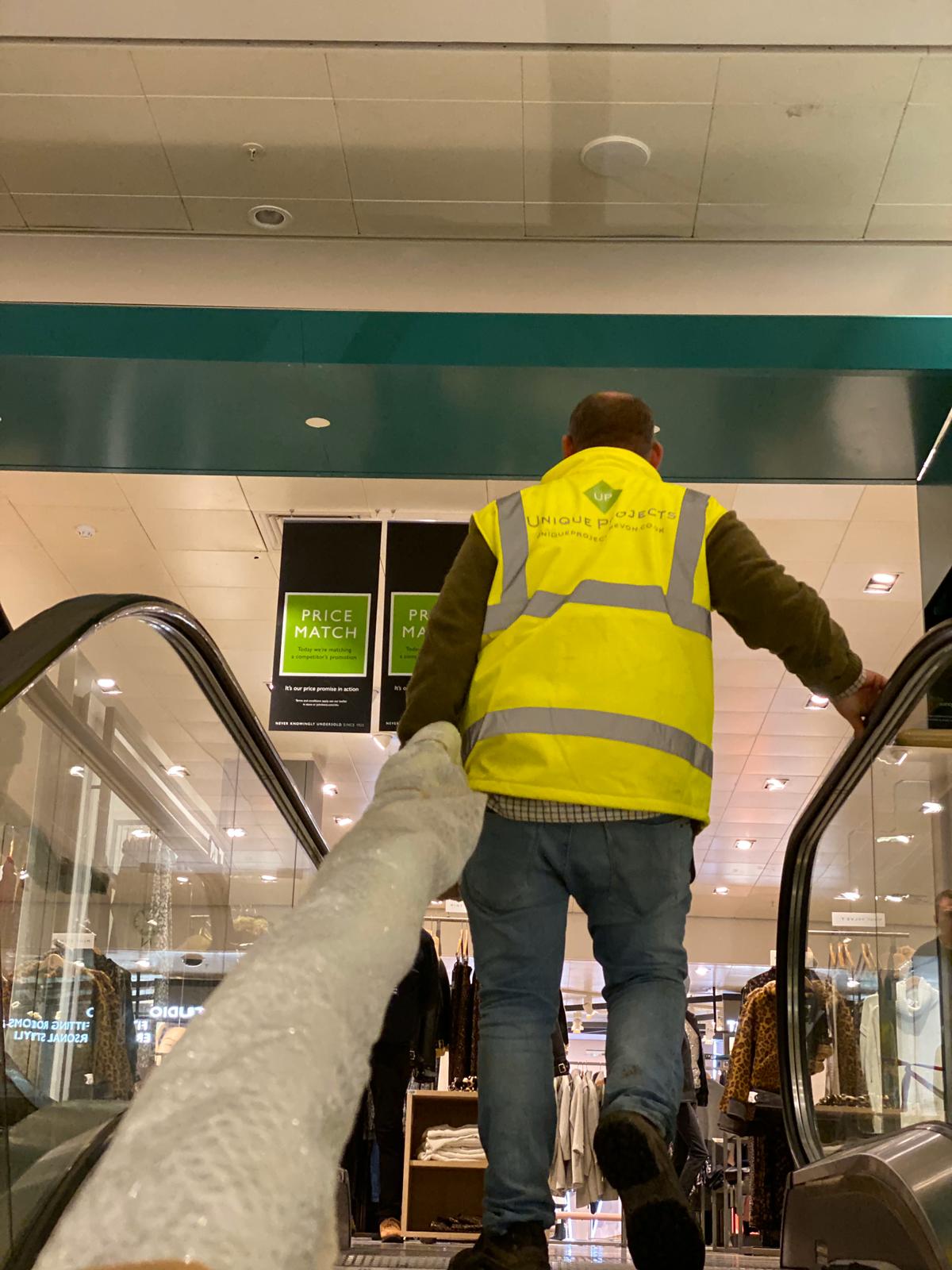 roof garden handrail being carried through John Lewis Store