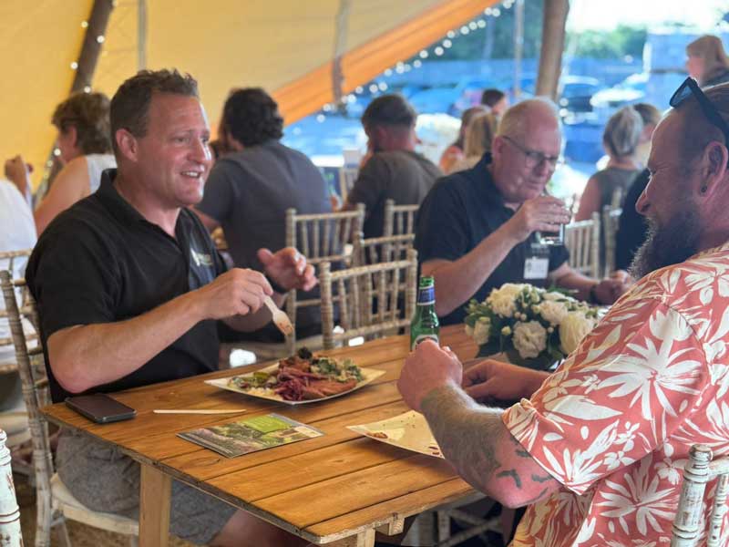 Richard Bickler chatting to garden designers over lunch at the June 2025 APL Supercluster