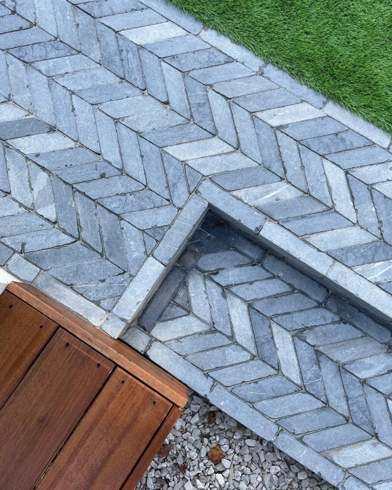 doorstep created with limestone paving bricks in a chevron pattern