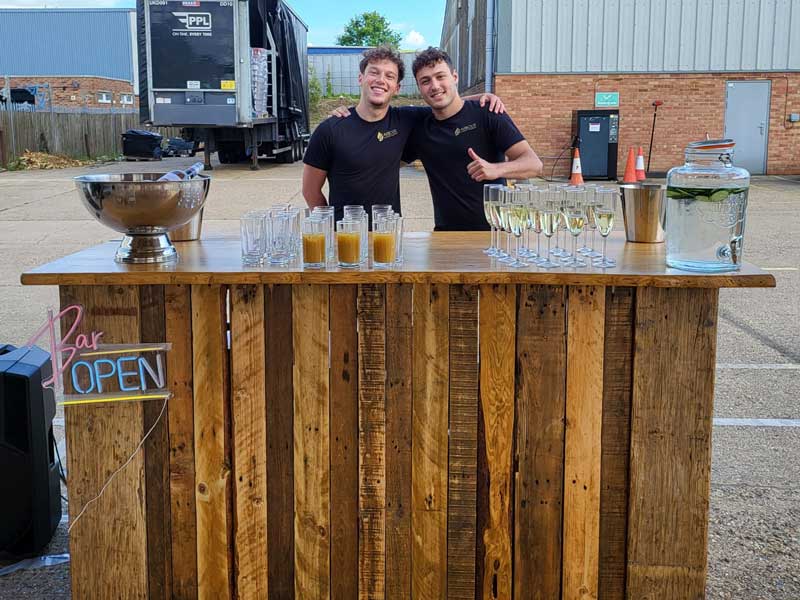 barkeepers preparing for the summer social event at Arbour Landscape Solutions yard