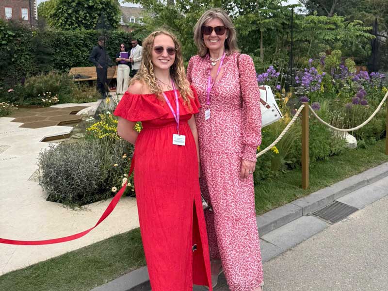 two ladies dressed in red at Chelsea Flower Show 2025 press day