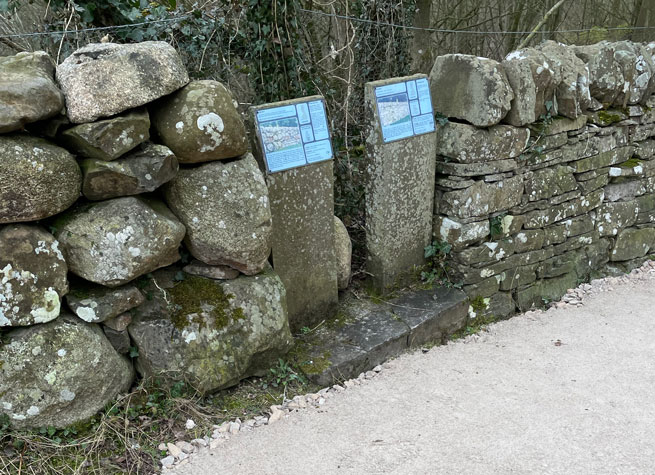 two contrasting types of dry stone wall, one using larger rocks, one with smaller, flatter slabs