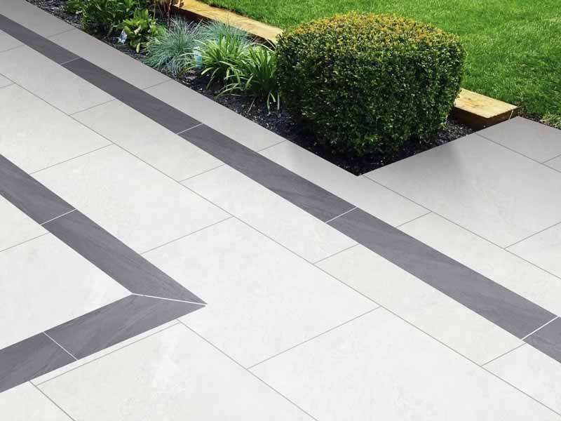 pale porcelain patio with duomo anthracite border tiles