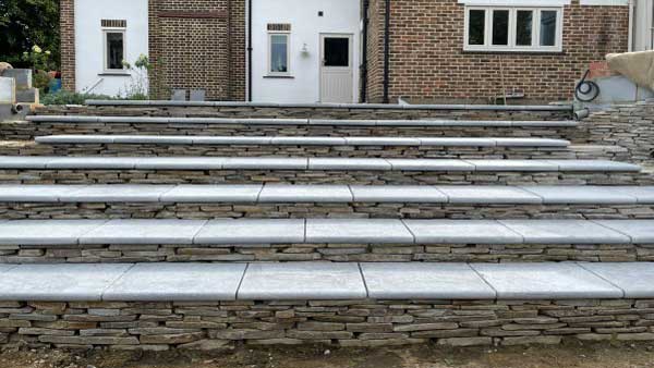 flight of steps with paddlestone risers and egyptian meli dark limestone treads 