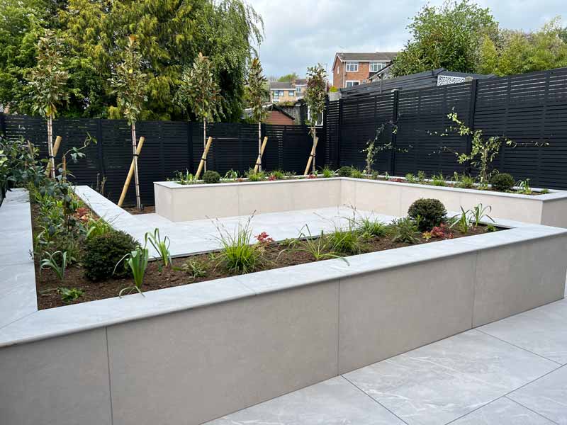 modern garden using porcelain cladding for garden walls on raised beds