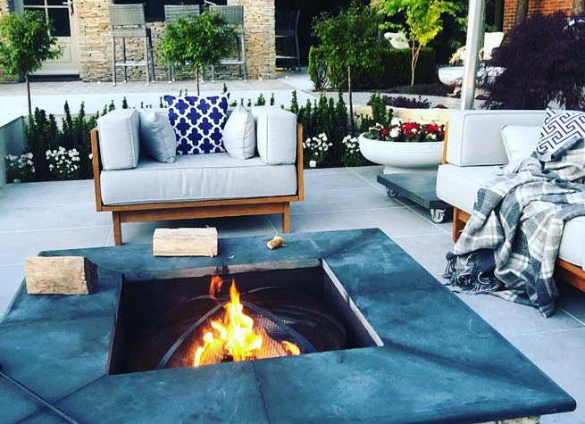 lifestyle shot of firepit in beautiful garden