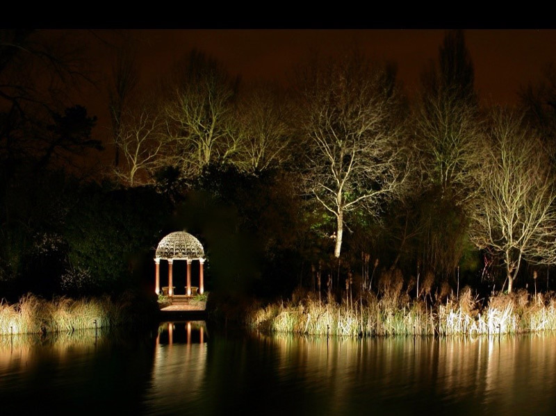 beautiful lakeside gazebo with garden lighting for evening