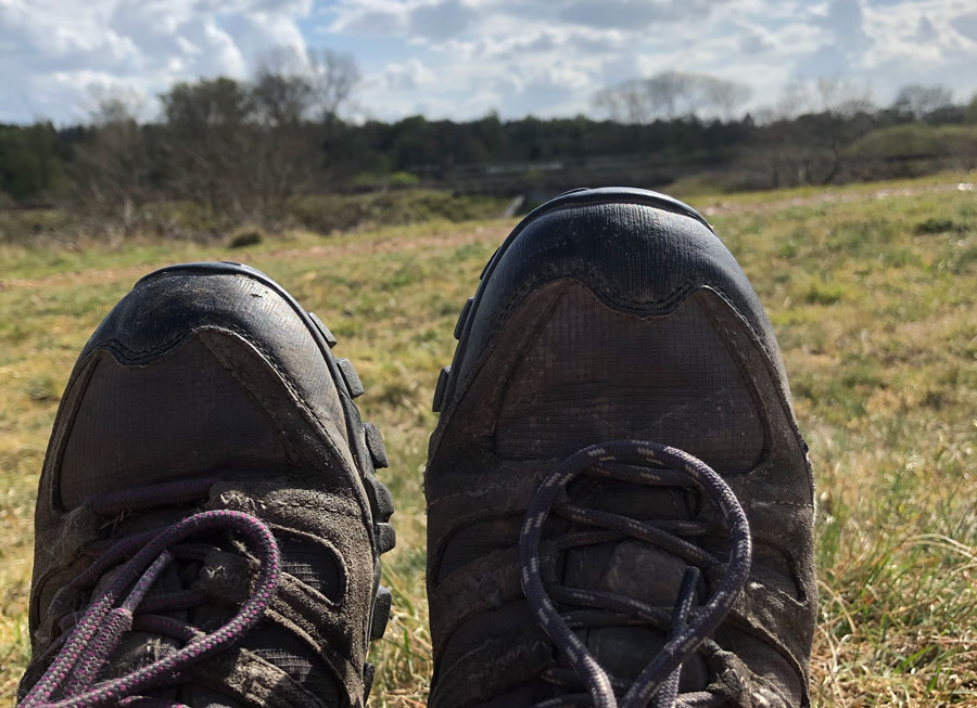 Walking boots with a background of Breckland countryside scenes