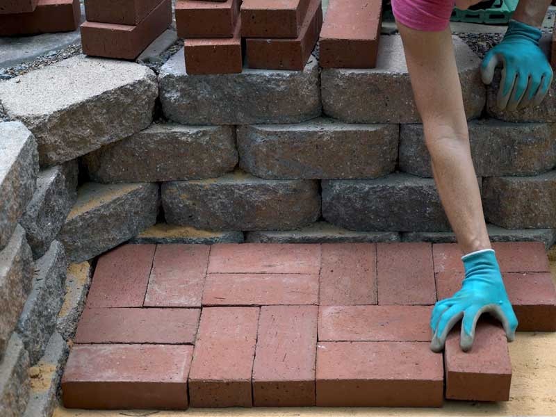 red clay pavers being used to create a simple basket weave laying pattern