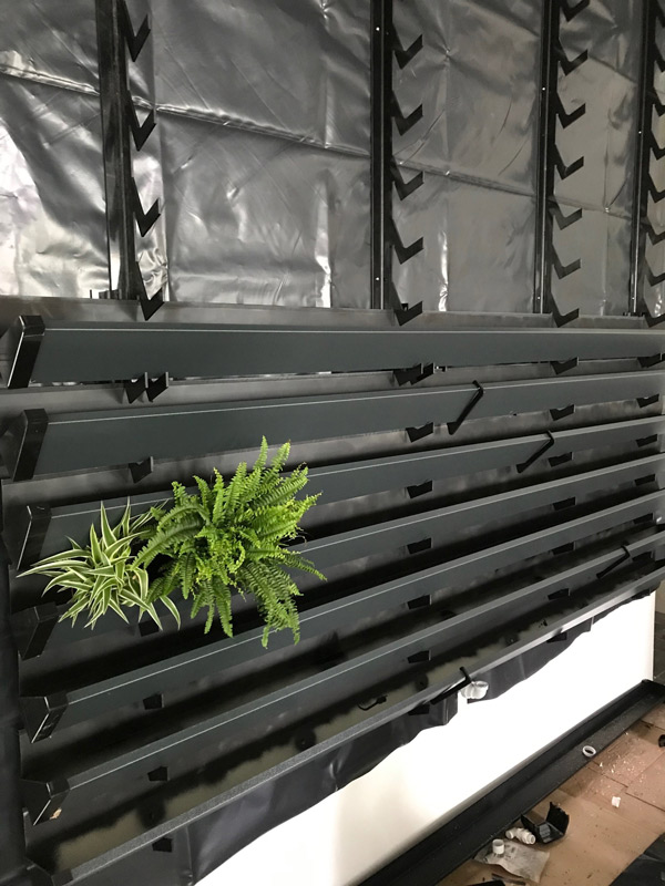 living wall system with rails and troughs