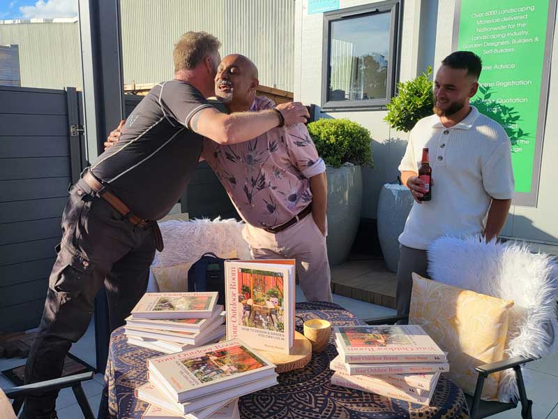 gareth wilson greets manoj Malde with a hug